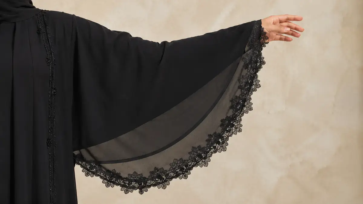 Close up of lace trimmed butterfly abaya sleeve detail
